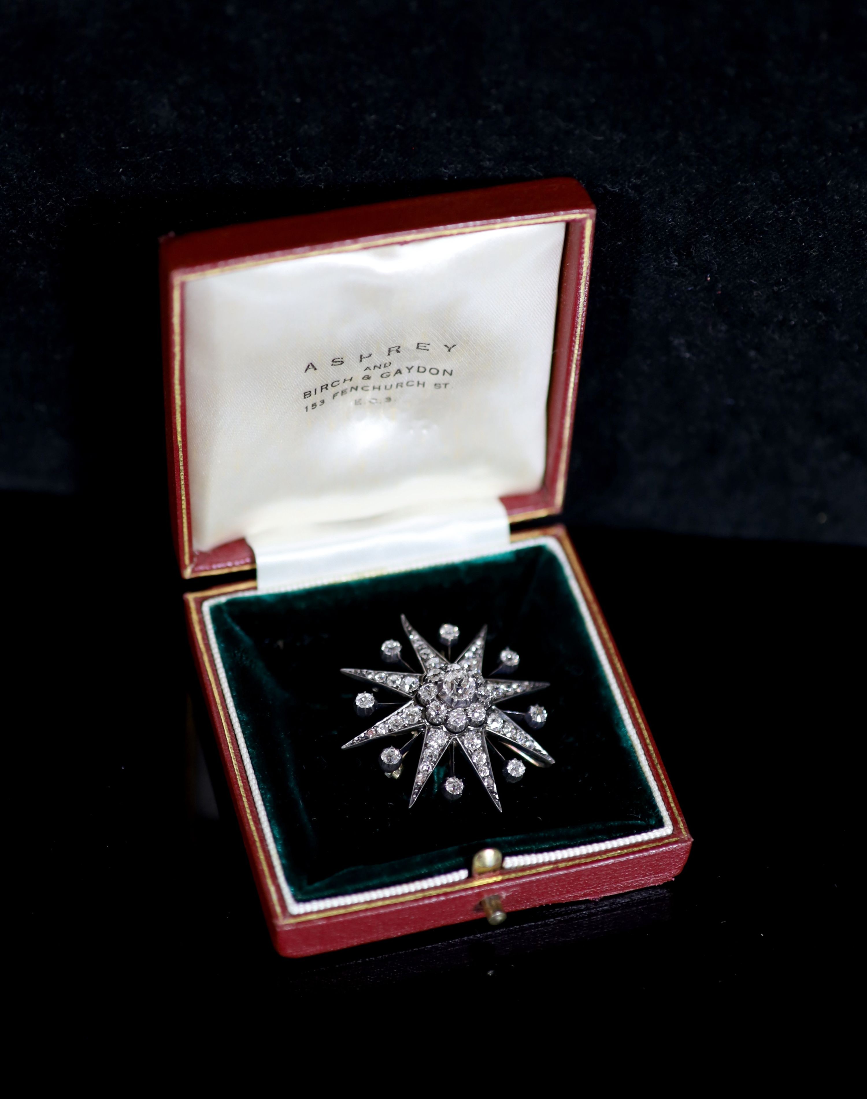 A Victorian gold, silver and diamond set starburst pendant brooch